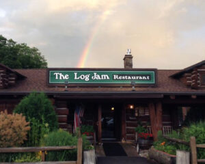 rainbow over log jam restaurant sign lake george outlets